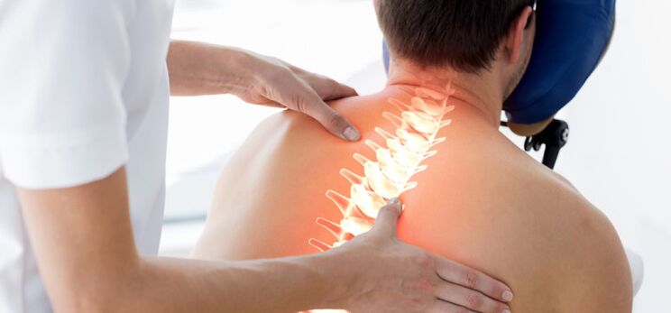 A patient with osteochondrosis examined by a doctor